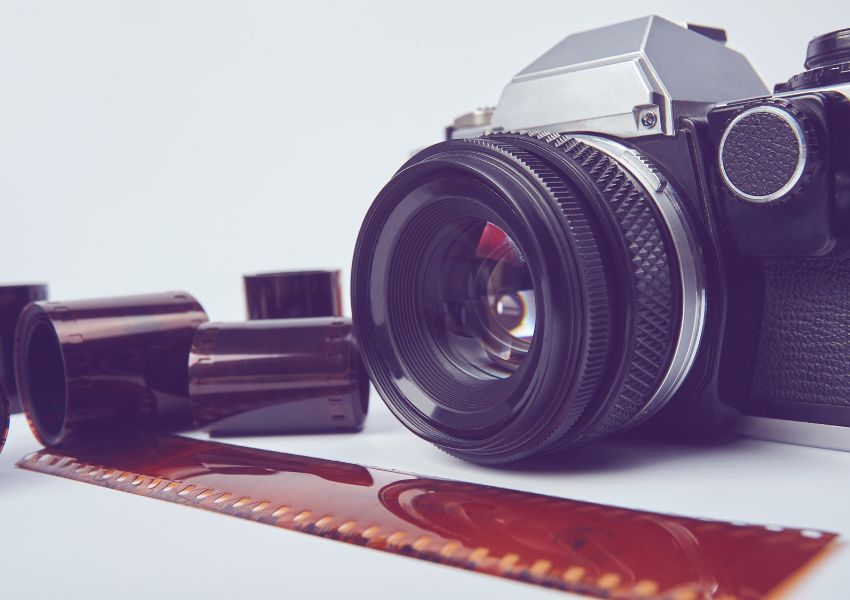 Camera-With-Film-Strip-In-Front-Of-It