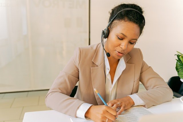 Property-Manager-Writing-At-Desk